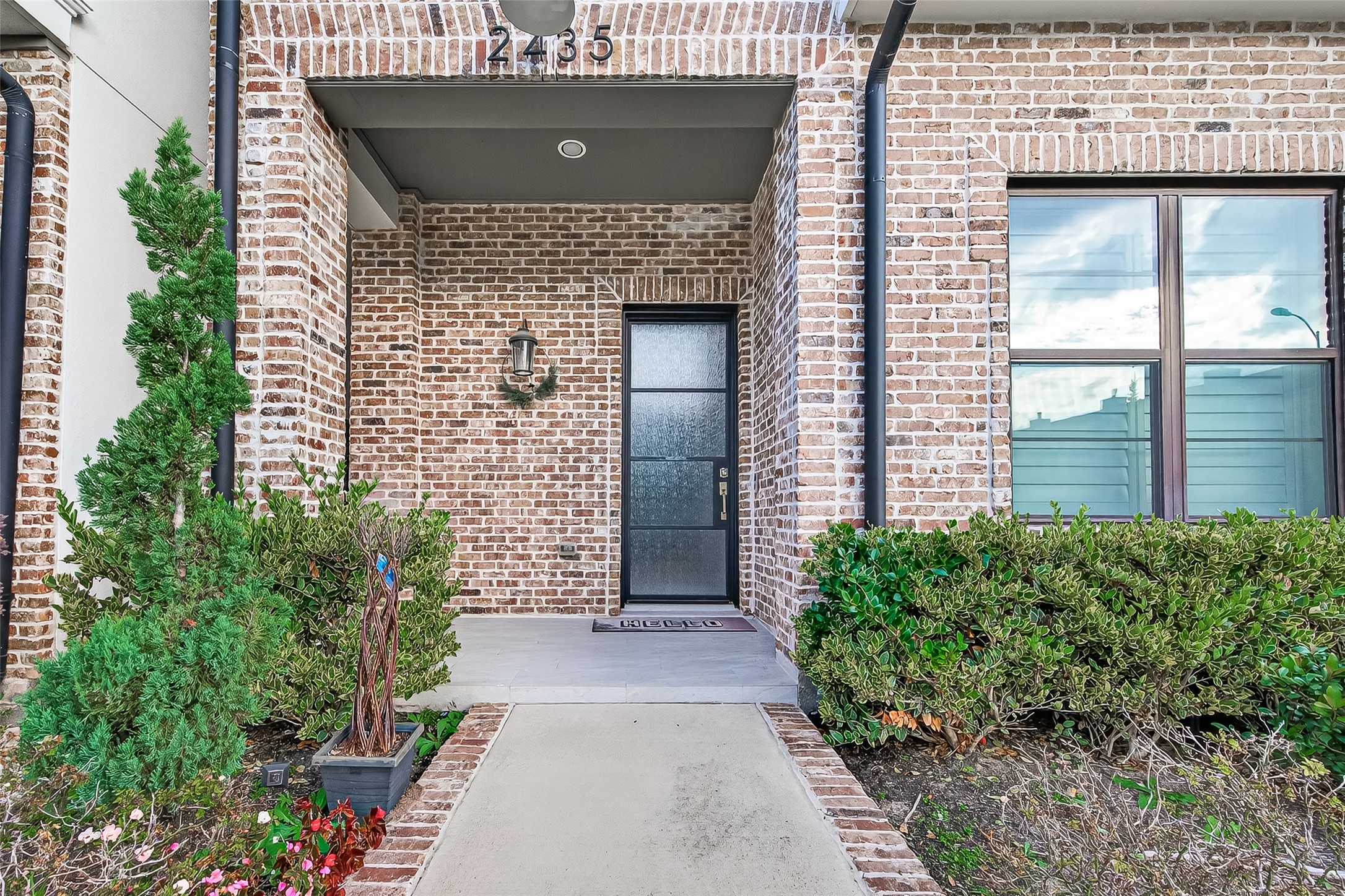 2435 Prairie Hollow Lane Houston, TX 77077 - Photo 3 of 50 a view of entrance gate of house and yard