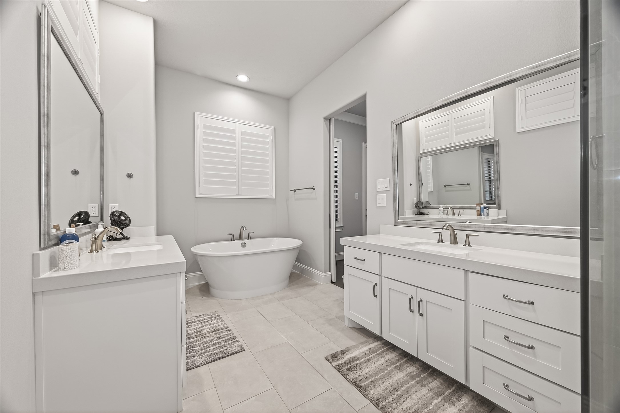 2435 Prairie Hollow Lane Houston, TX 77077 - Photo 31 of 50 a bathroom with a double vanity sink a toilet and a mirror