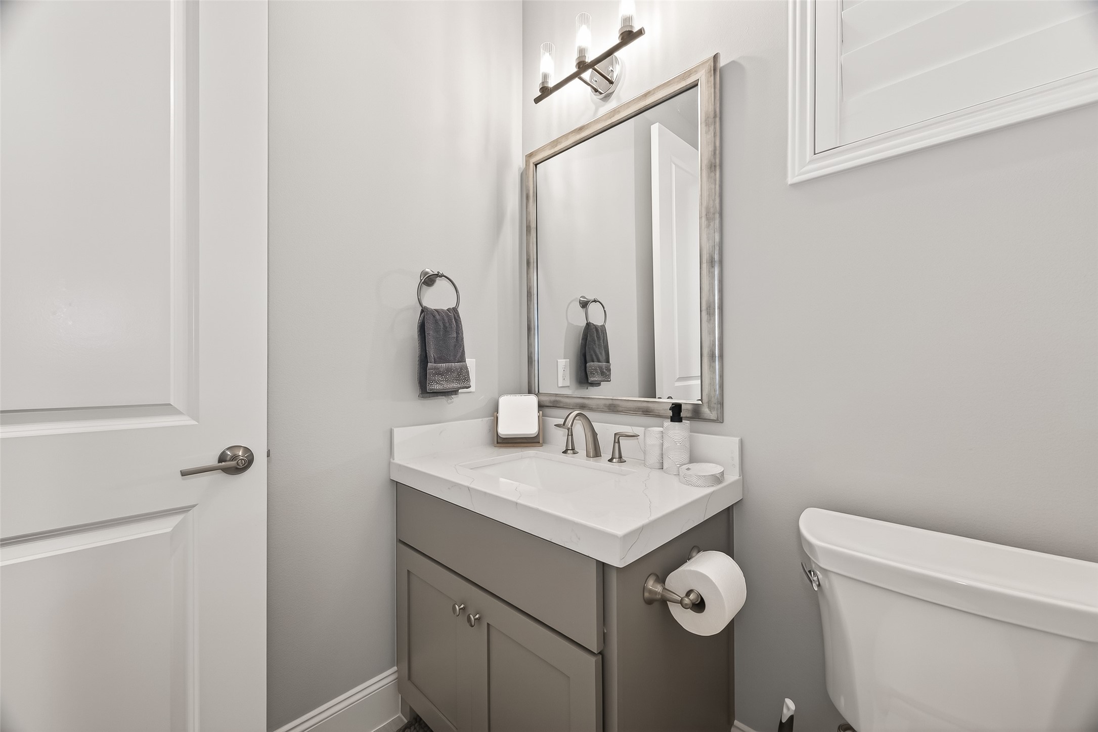 2435 Prairie Hollow Lane Houston, TX 77077 - Photo 43 of 50 a bathroom with a sink a toilet and mirror