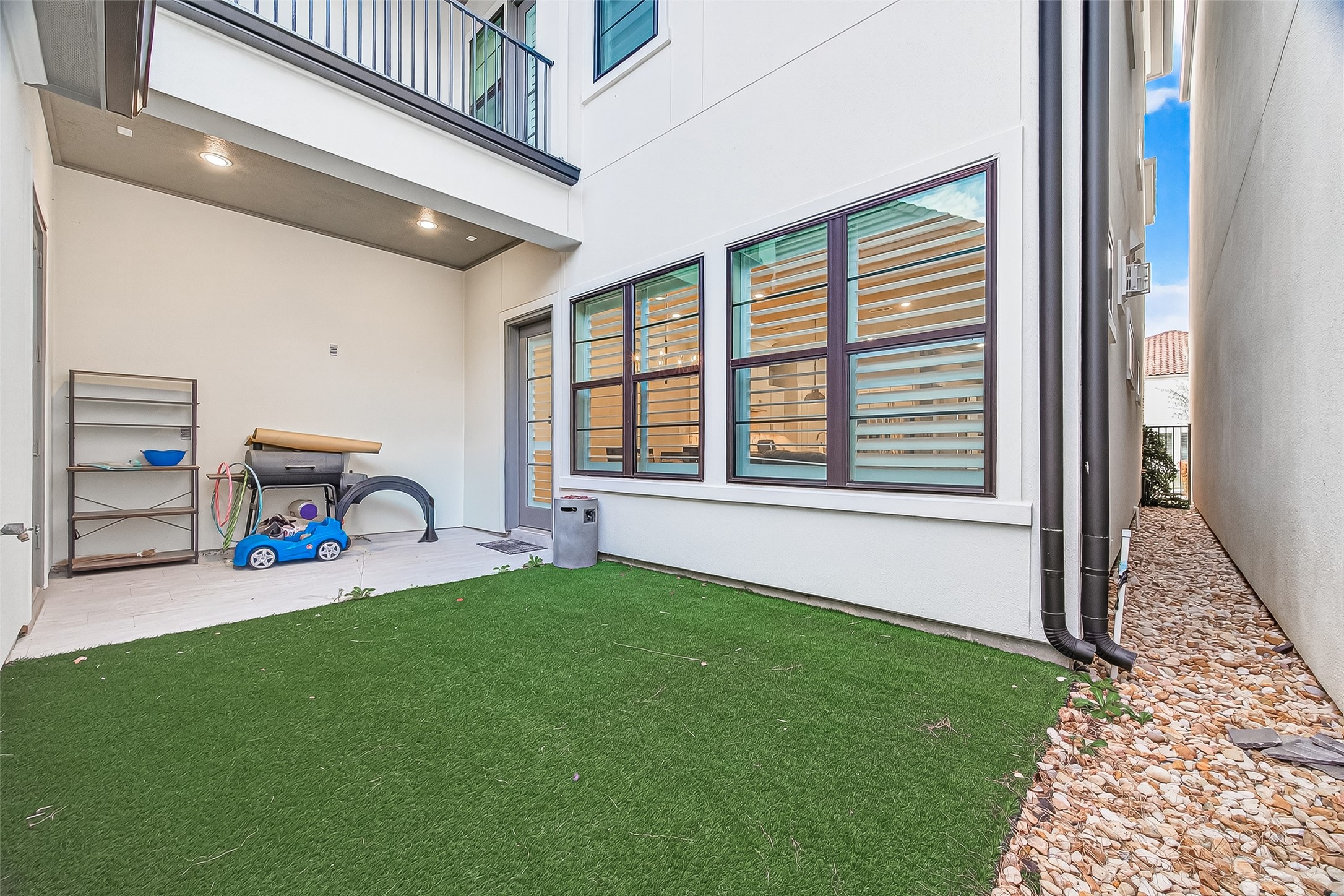 2435 Prairie Hollow Lane Houston, TX 77077 - Photo 49 of 50 a view of a porch with furniture and a gate