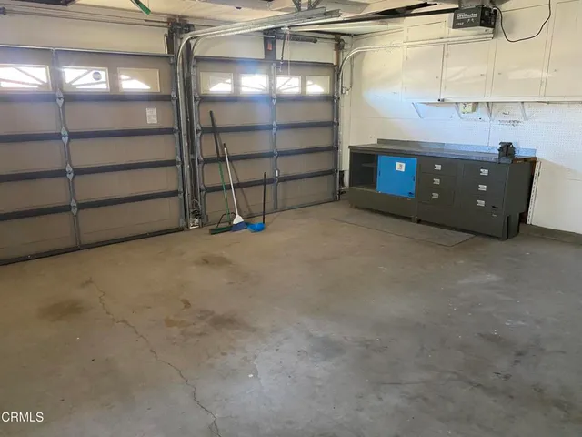 a view of an empty room with a fireplace