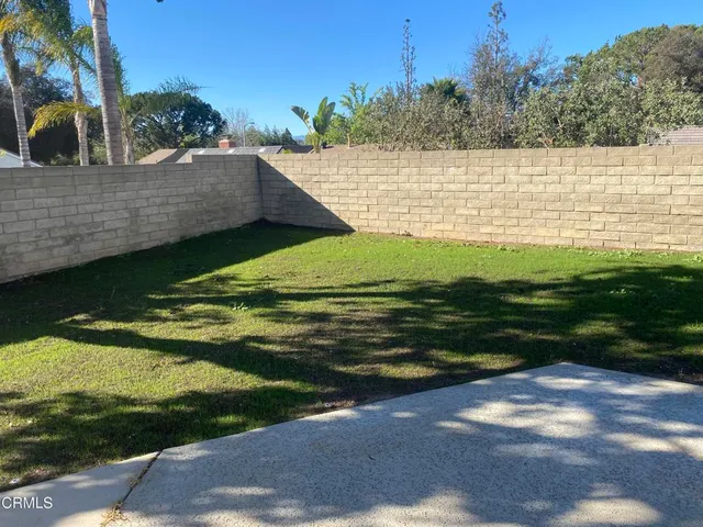 a view of a lake with a yard