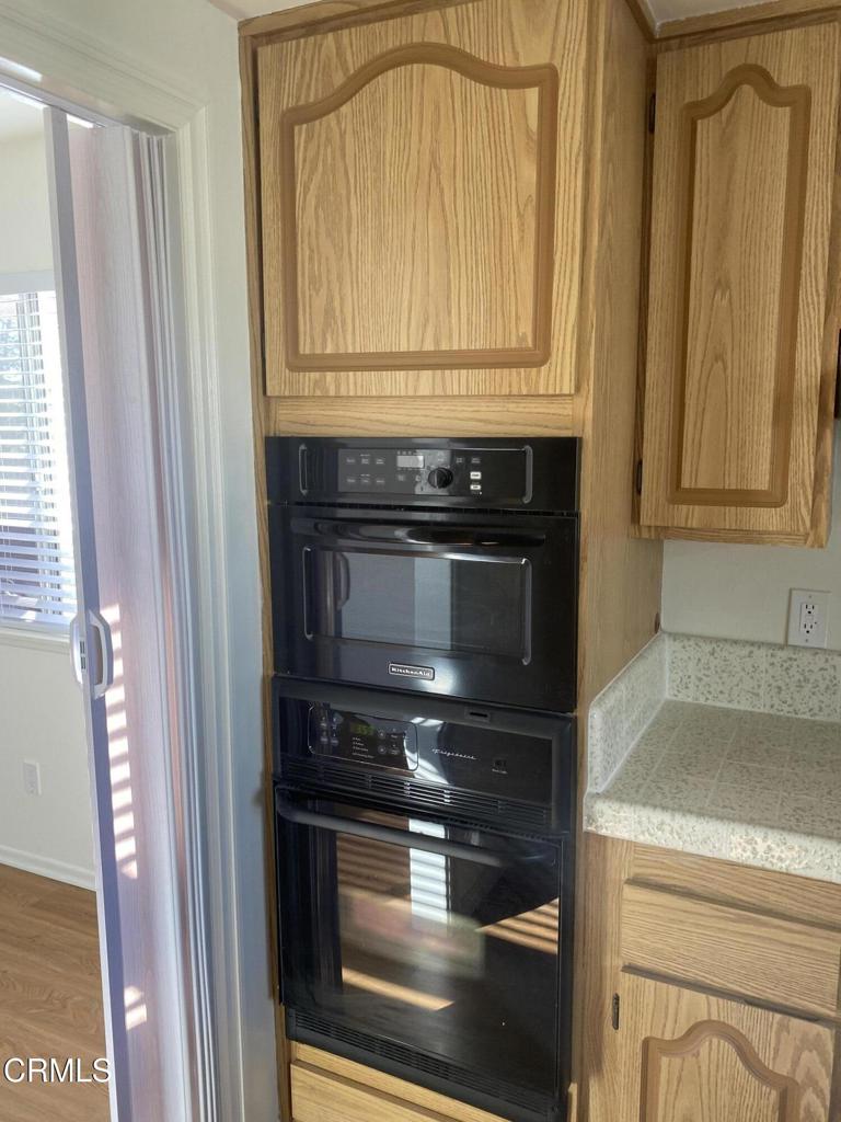 3 Venus Street Thousand Oaks, CA 91360 - Photo 10 of 27 a kitchen with granite countertop cabinets stainless steel appliances and a window