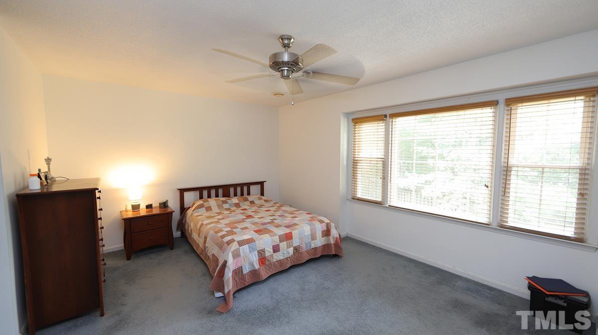2947 Wycliff Road Raleigh, NC 27607 - Photo 11 of 11 a bedroom with a bed and a window