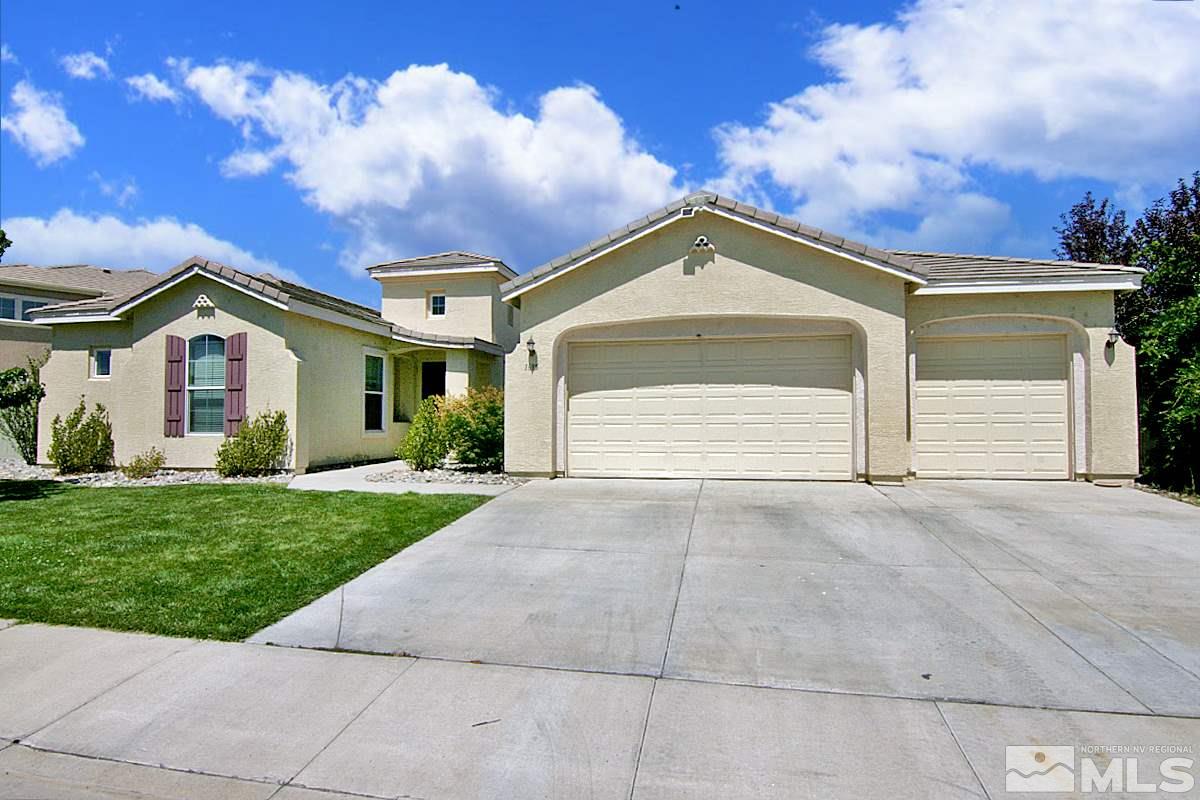 1695 Silver Thread Drive Reno, NV 89521 - Photo 1 of 15 a front view of a house with a yard and garage