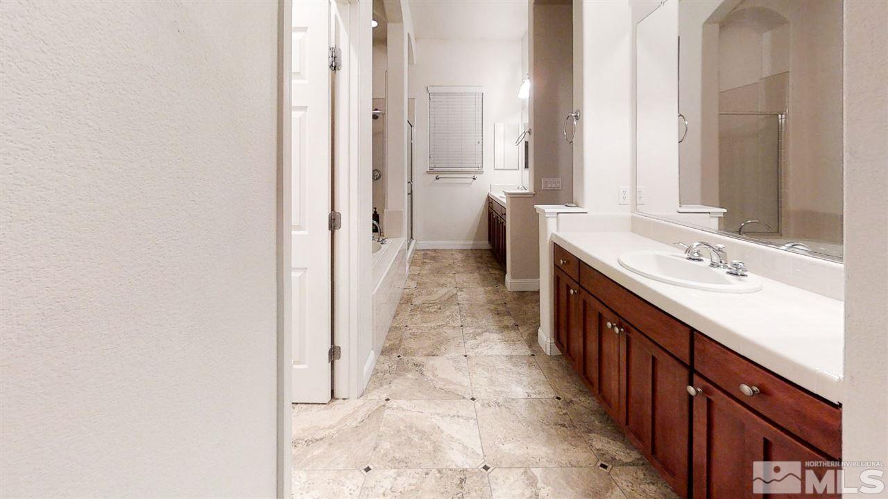 1695 Silver Thread Drive Reno, NV 89521 - Photo 11 of 15 a bathroom with a sink and a mirror