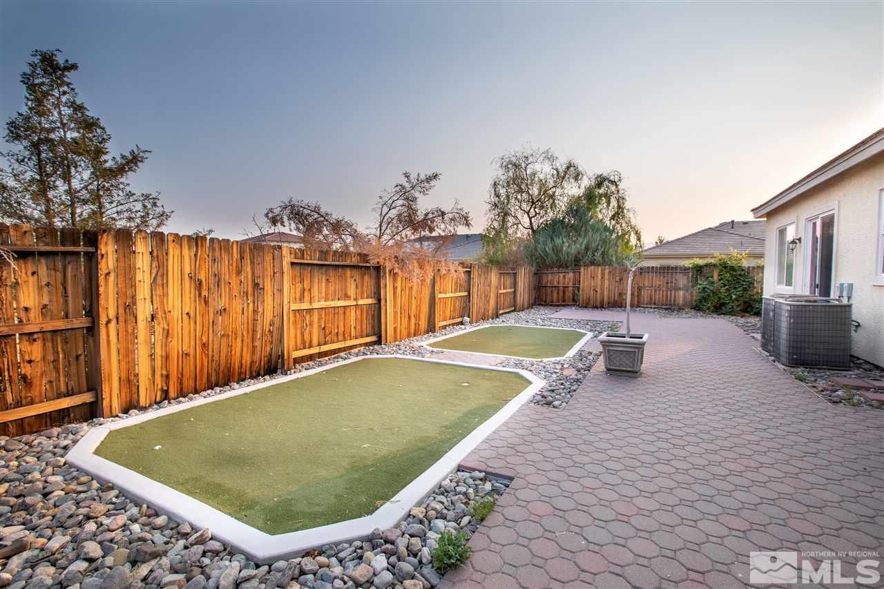 1695 Silver Thread Drive Reno, NV 89521 - Photo 15 of 15 a swimming pool with outdoor seating and yard