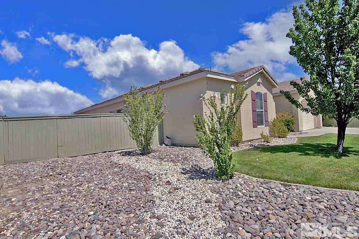 1695 Silver Thread Drive Reno, NV 89521 - Photo 3 of 15 a front view of a house with garden