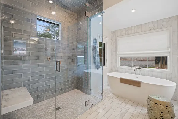 a bathroom with a bathtub and a sink