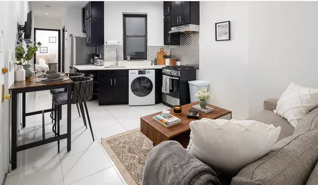 a living room with furniture and a table