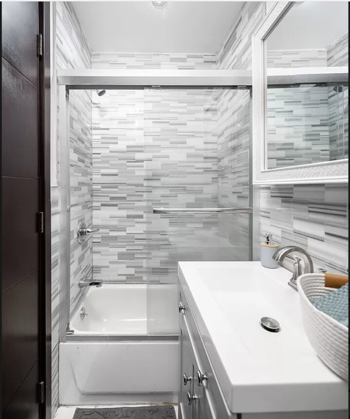 21 West 106th Street, Unit 4A Manhattan, NY 10025 - Photo 6 of 6 a bathroom with a sink a toilet and shower