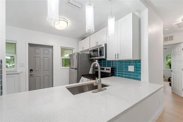 a room with a bed and furniture