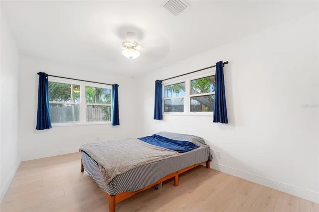 a bedroom with a bed and window