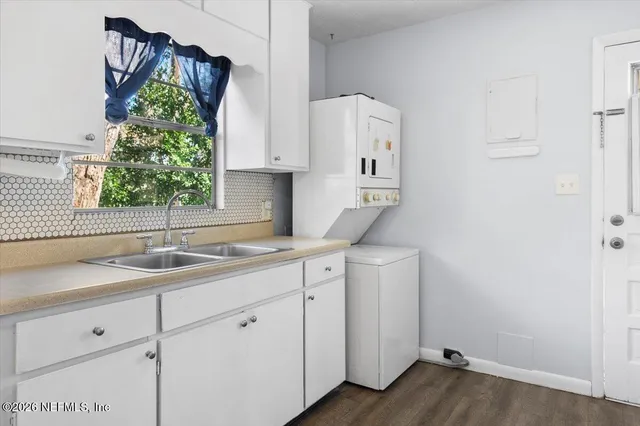 a kitchen with a sink and cabinets