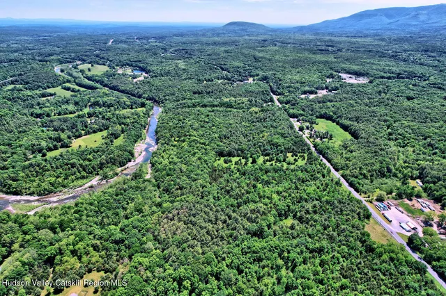 a bathroom with a sink vanity toilet and shower