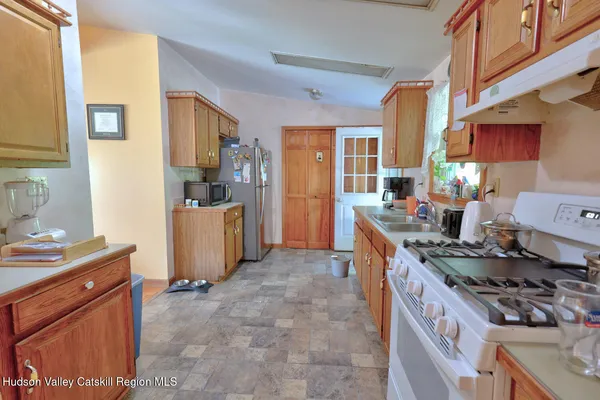 front view of a wooden house with a yard