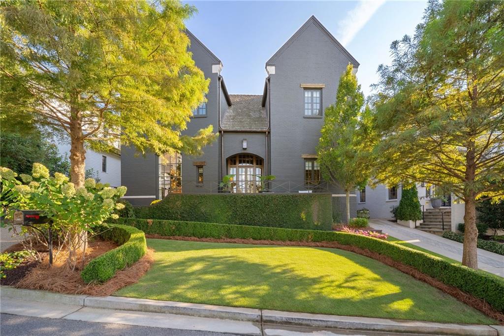 6570 Five Oaks Road Cumming, GA 30040 - Photo 104 of 136 a front view of a house with a garden