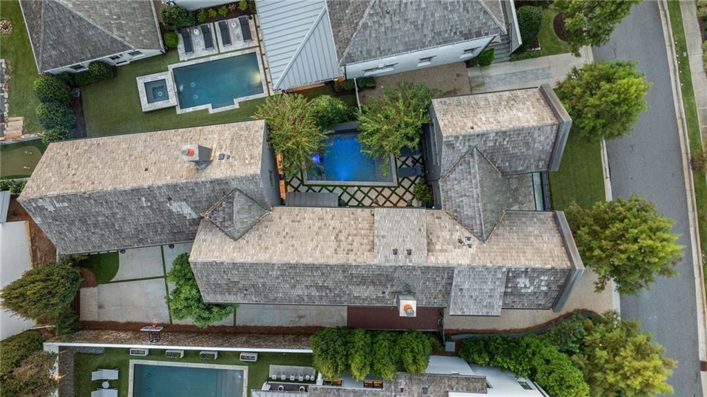 6570 Five Oaks Road Cumming, GA 30040 - Photo 105 of 136 an aerial view of a house with a garden and plants
