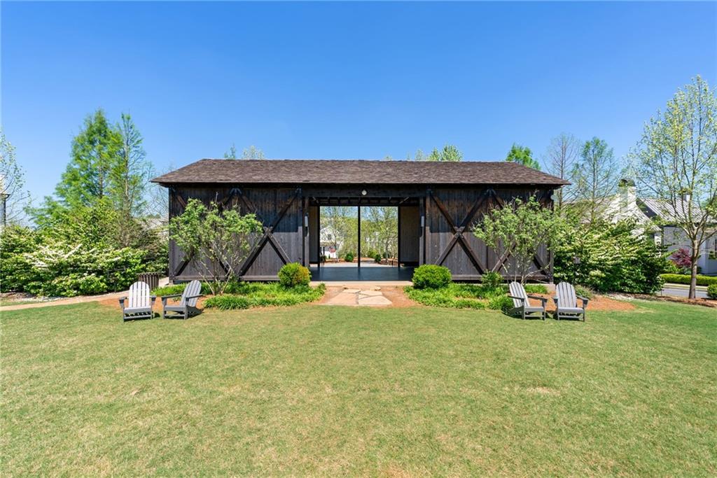 6570 Five Oaks Road Cumming, GA 30040 - Photo 121 of 136 a view of a house with backyard porch and sitting area