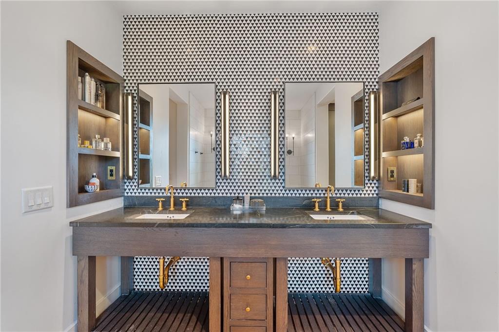 6570 Five Oaks Road Cumming, GA 30040 - Photo 13 of 136 a bathroom with a sink and a mirror