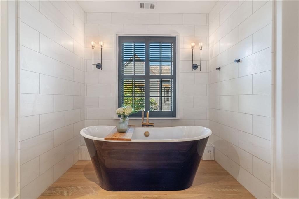 6570 Five Oaks Road Cumming, GA 30040 - Photo 14 of 136 a bathroom with a bathtub