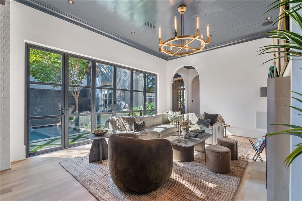 6570 Five Oaks Road Cumming, GA 30040 - Photo 23 of 136 a living room with furniture and a large window