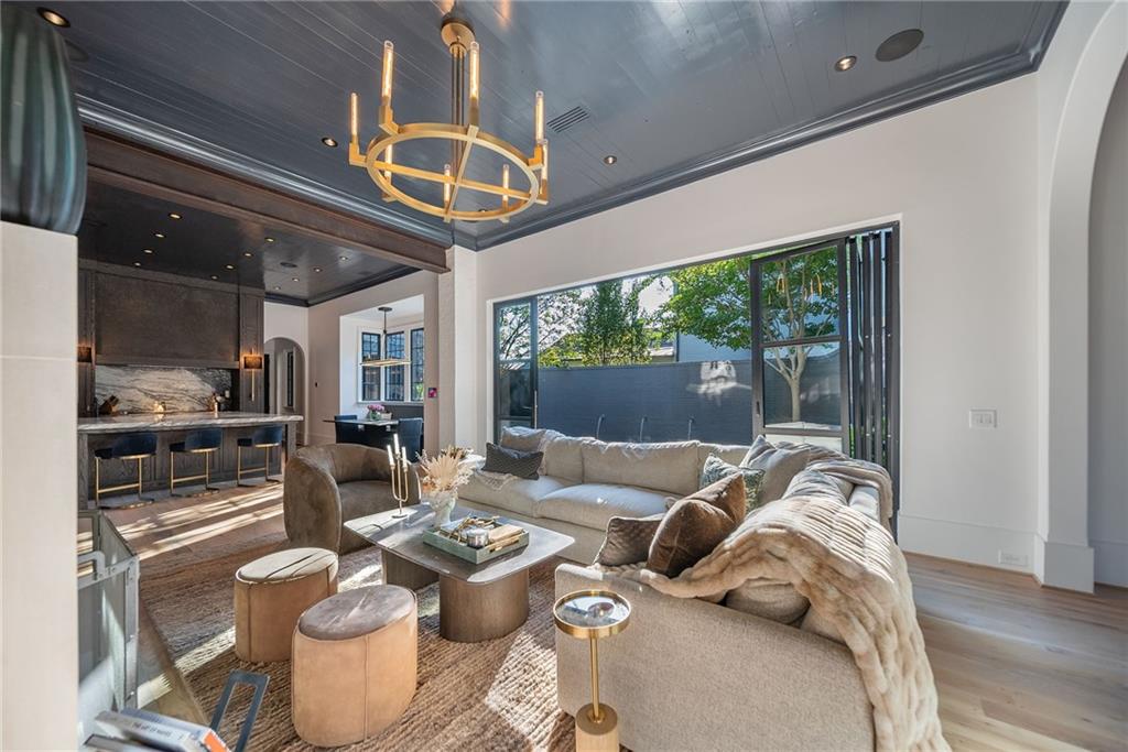 6570 Five Oaks Road Cumming, GA 30040 - Photo 28 of 136 a living room with furniture and a large window