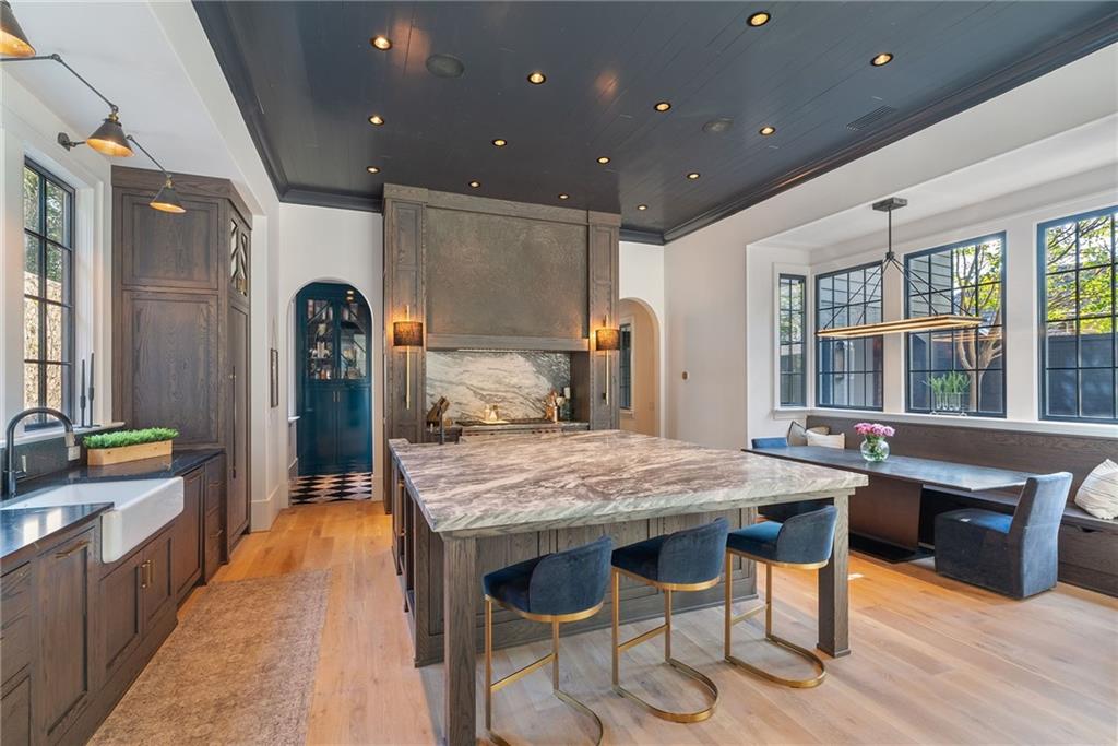 6570 Five Oaks Road Cumming, GA 30040 - Photo 32 of 136 a dining hall with stainless steel appliances granite countertop a stove and a sink