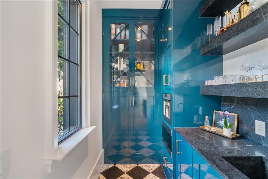 6570 Five Oaks Road Cumming, GA 30040 - Photo 38 of 136 a bathroom with a granite countertop sink a mirror and shower