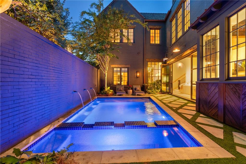 6570 Five Oaks Road Cumming, GA 30040 - Photo 4 of 136 a view of swimming pool with outdoor seating