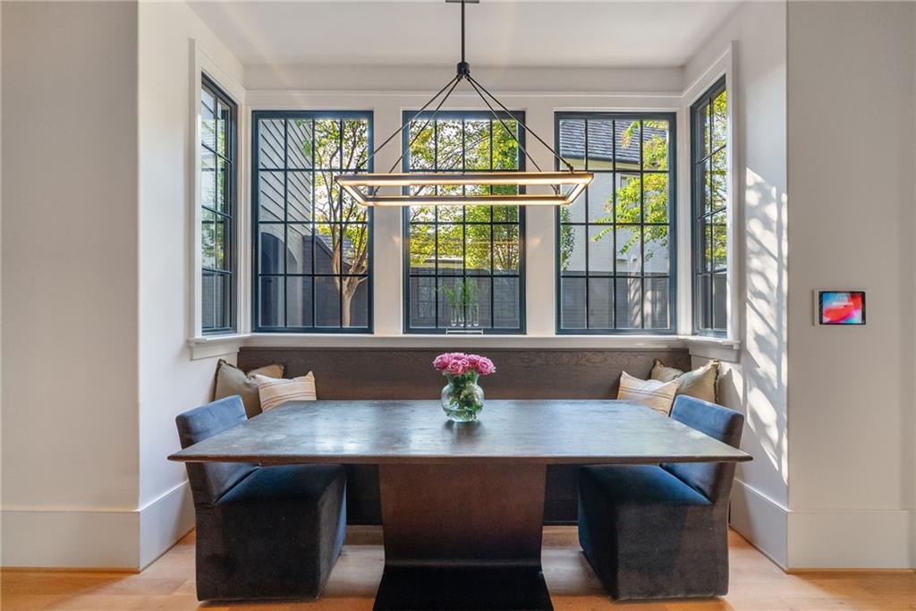 6570 Five Oaks Road Cumming, GA 30040 - Photo 41 of 136 a view of a dining room with furniture window and wooden floor