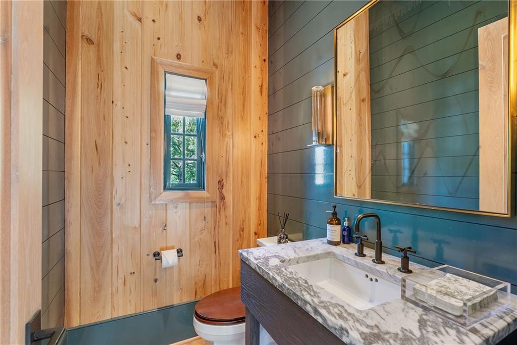 6570 Five Oaks Road Cumming, GA 30040 - Photo 45 of 136 a bathroom with a granite countertop sink a toilet and shower