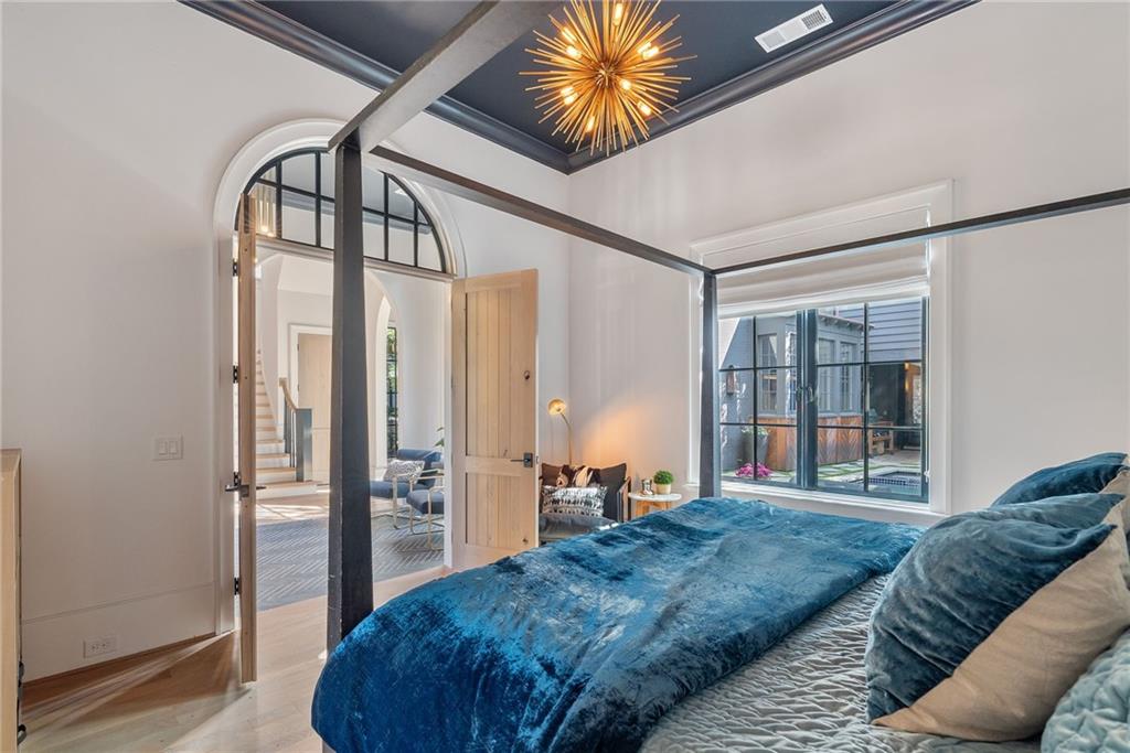 6570 Five Oaks Road Cumming, GA 30040 - Photo 48 of 136 a bedroom with a bed next to a window with outer view