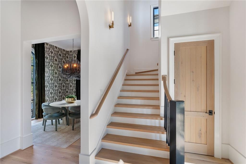 6570 Five Oaks Road Cumming, GA 30040 - Photo 51 of 136 a view of a hallway with wooden floor and entryway
