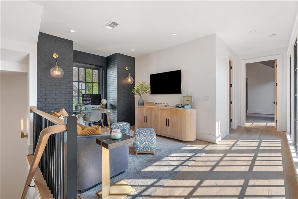 6570 Five Oaks Road Cumming, GA 30040 - Photo 52 of 136 a living room with furniture and a flat screen tv