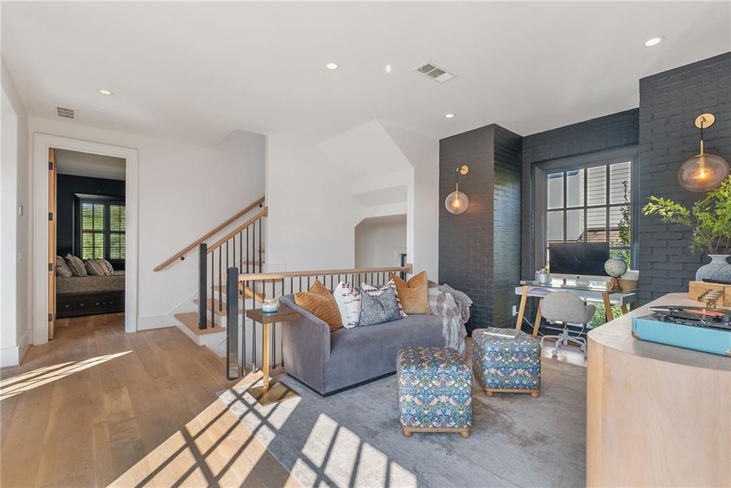 6570 Five Oaks Road Cumming, GA 30040 - Photo 53 of 136 a living room with furniture and wooden floor