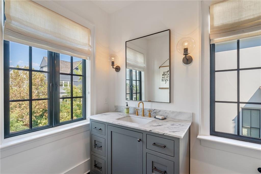 6570 Five Oaks Road Cumming, GA 30040 - Photo 66 of 136 a bathroom with a granite countertop sink mirror and a window