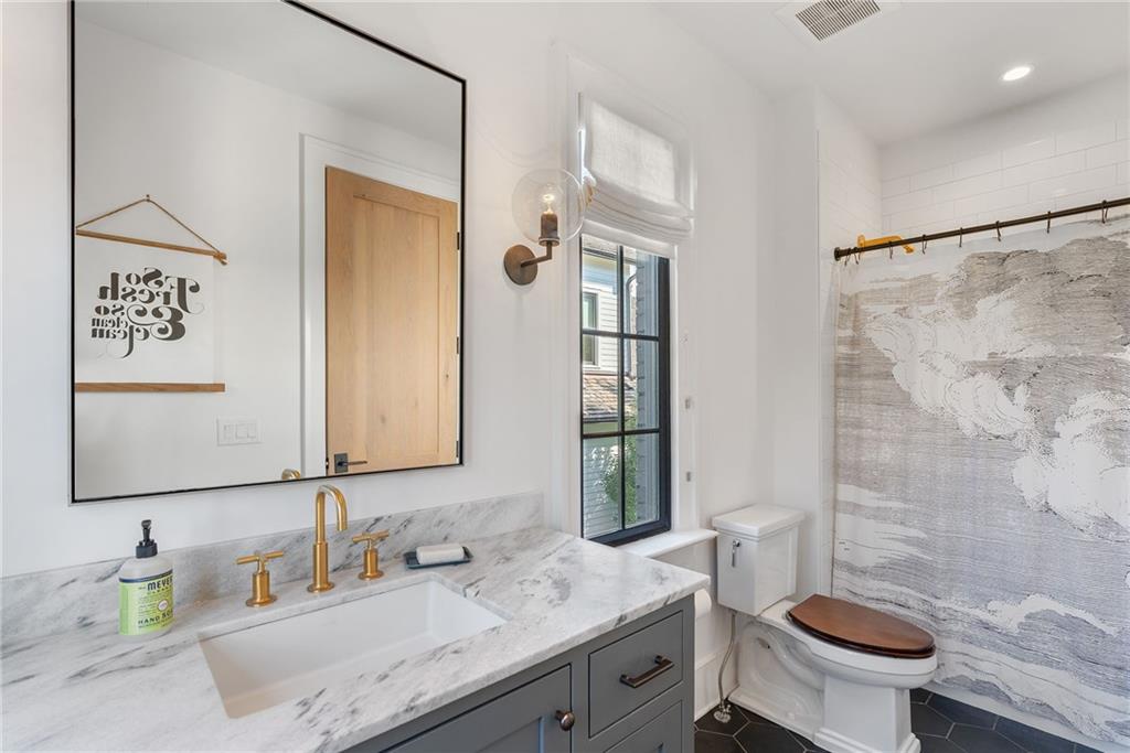 6570 Five Oaks Road Cumming, GA 30040 - Photo 67 of 136 a bathroom with a granite countertop sink toilet and shower