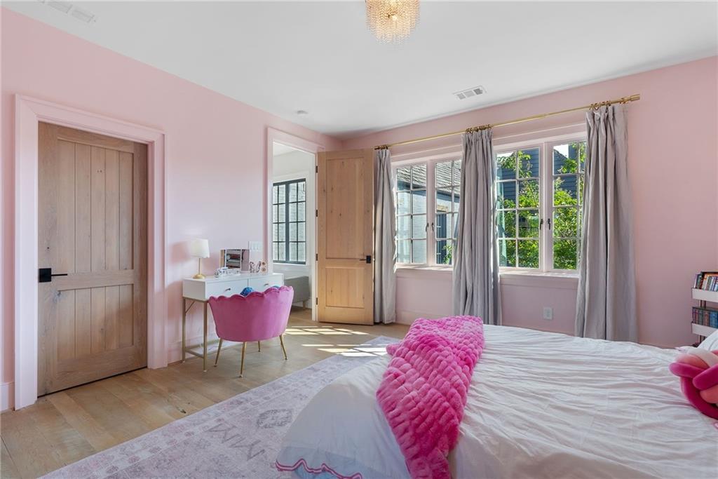 6570 Five Oaks Road Cumming, GA 30040 - Photo 69 of 136 a bedroom with a bed and large window