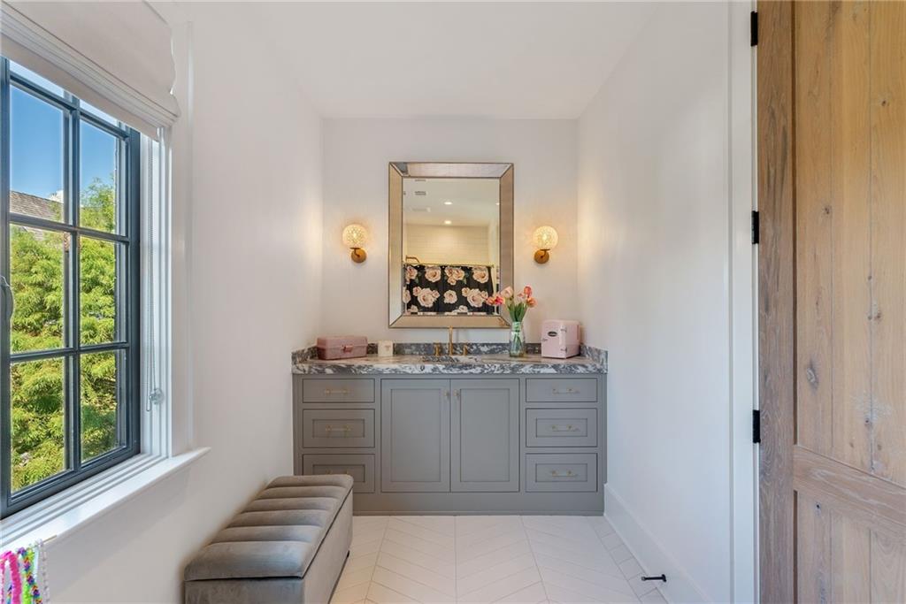 6570 Five Oaks Road Cumming, GA 30040 - Photo 70 of 136 a bathroom with a granite countertop sink and a mirror