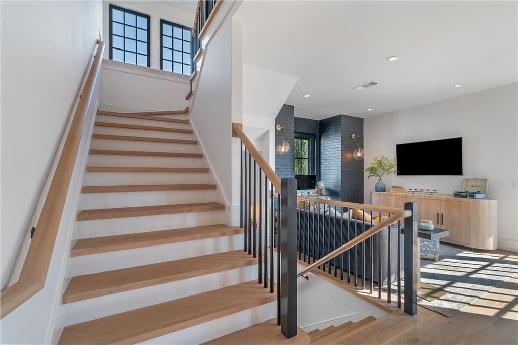 6570 Five Oaks Road Cumming, GA 30040 - Photo 72 of 136 a view of entryway and hall with wooden floor