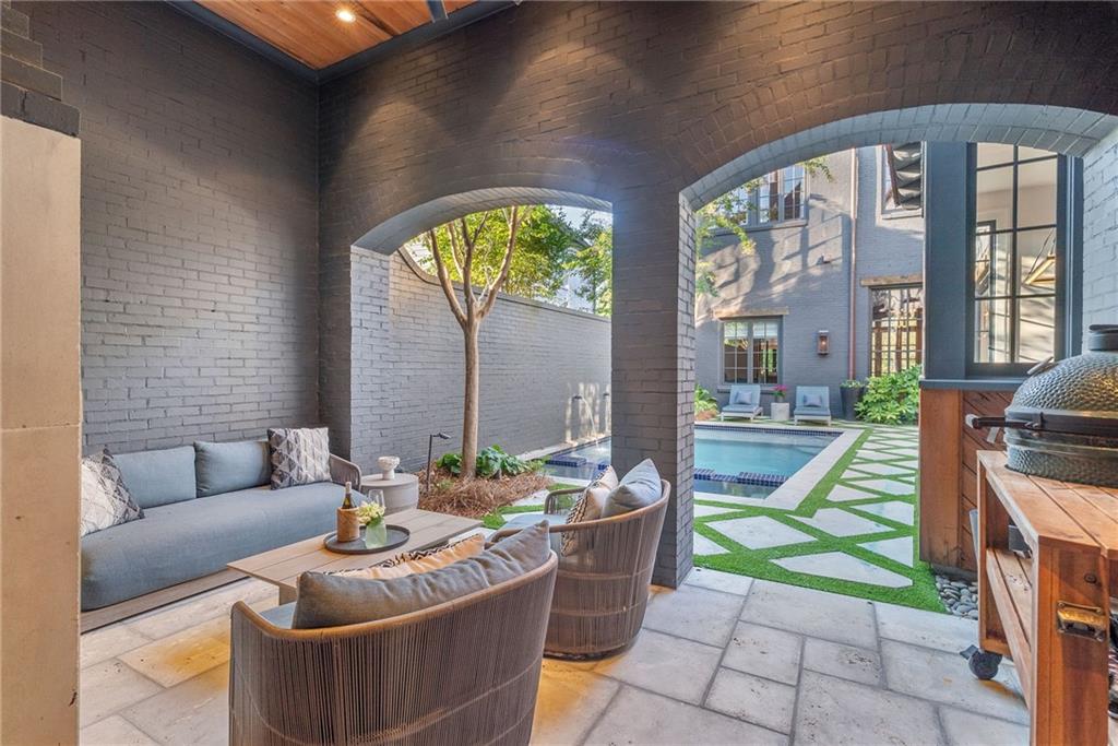 6570 Five Oaks Road Cumming, GA 30040 - Photo 81 of 136 a living room with furniture and a floor to ceiling window