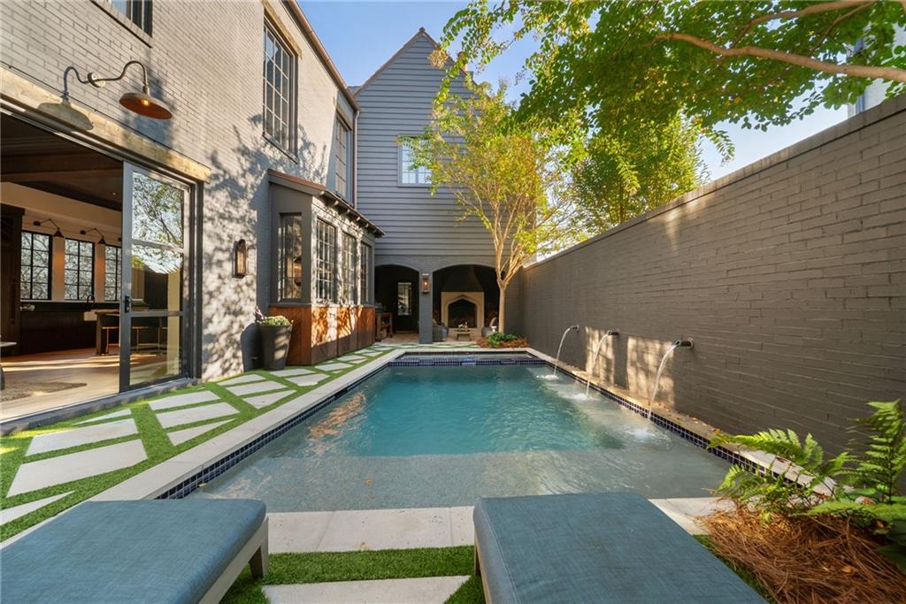 6570 Five Oaks Road Cumming, GA 30040 - Photo 85 of 136 a view of a patio with table and chairs and potted plants