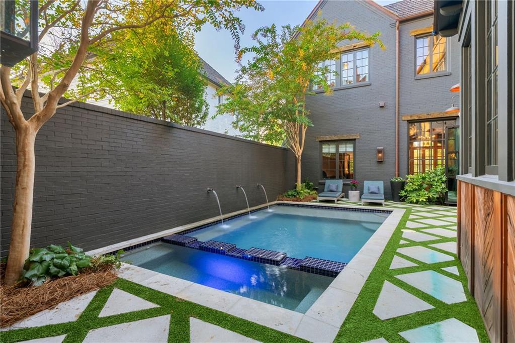 6570 Five Oaks Road Cumming, GA 30040 - Photo 87 of 136 a view of swimming pool with seating area and trees in the background