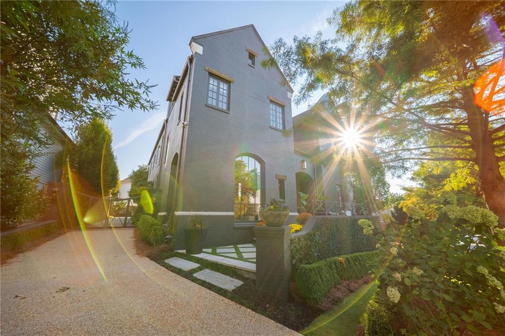 6570 Five Oaks Road Cumming, GA 30040 - Photo 97 of 136 a view of a brick house with a small yard and large tree