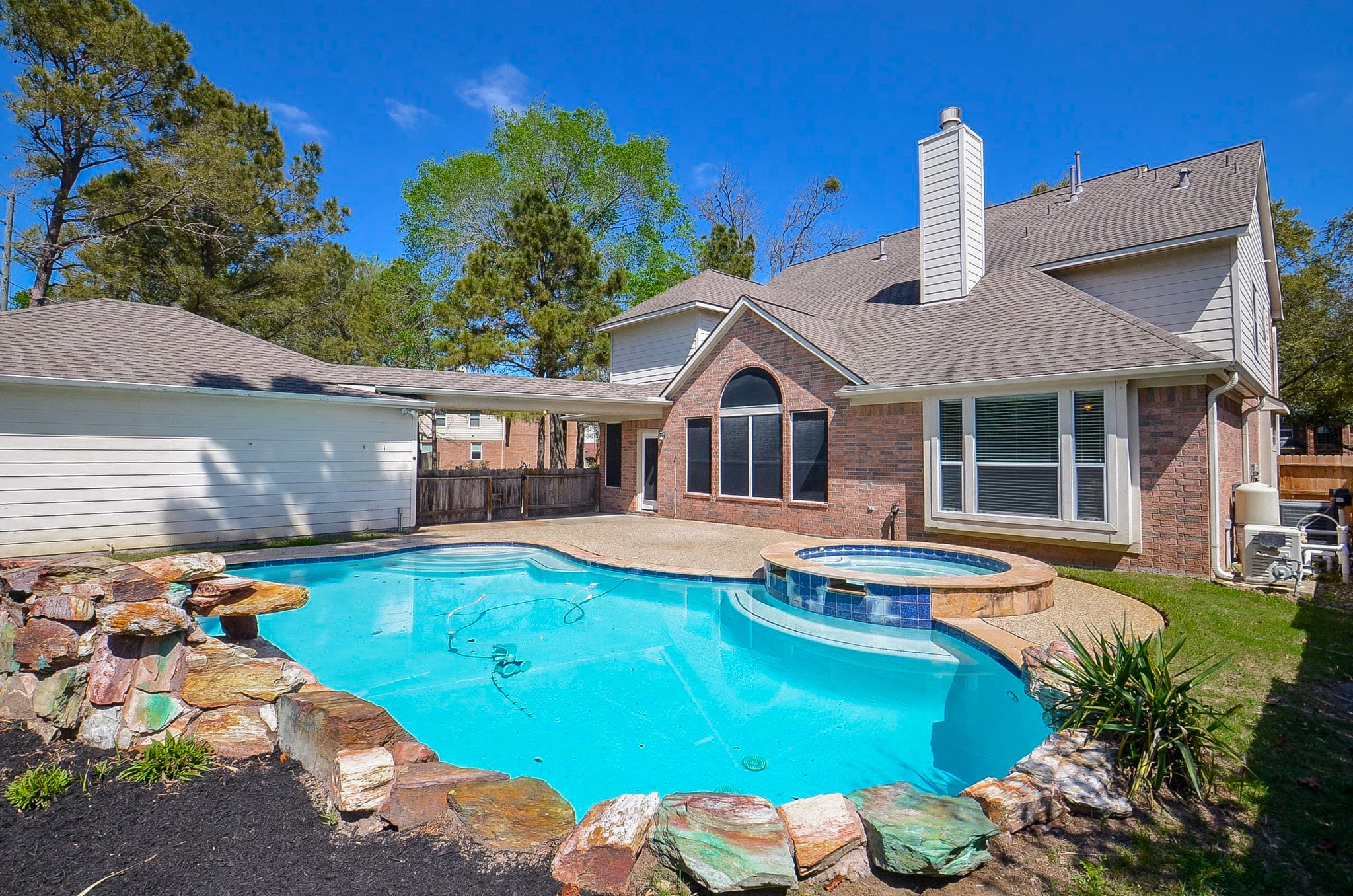 23615 Banning Point Court Katy, TX 77494 - Photo 1 of 50 a front view of a house with swimming pool having outdoor seating