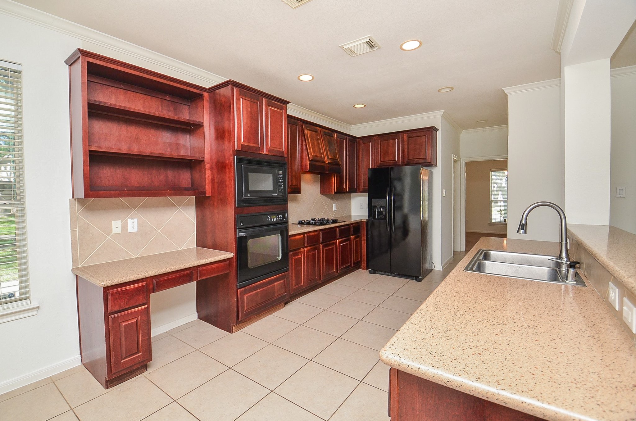23615 Banning Point Court Katy, TX 77494 - Photo 19 of 50 a kitchen with stainless steel appliances a refrigerator and a stove top oven