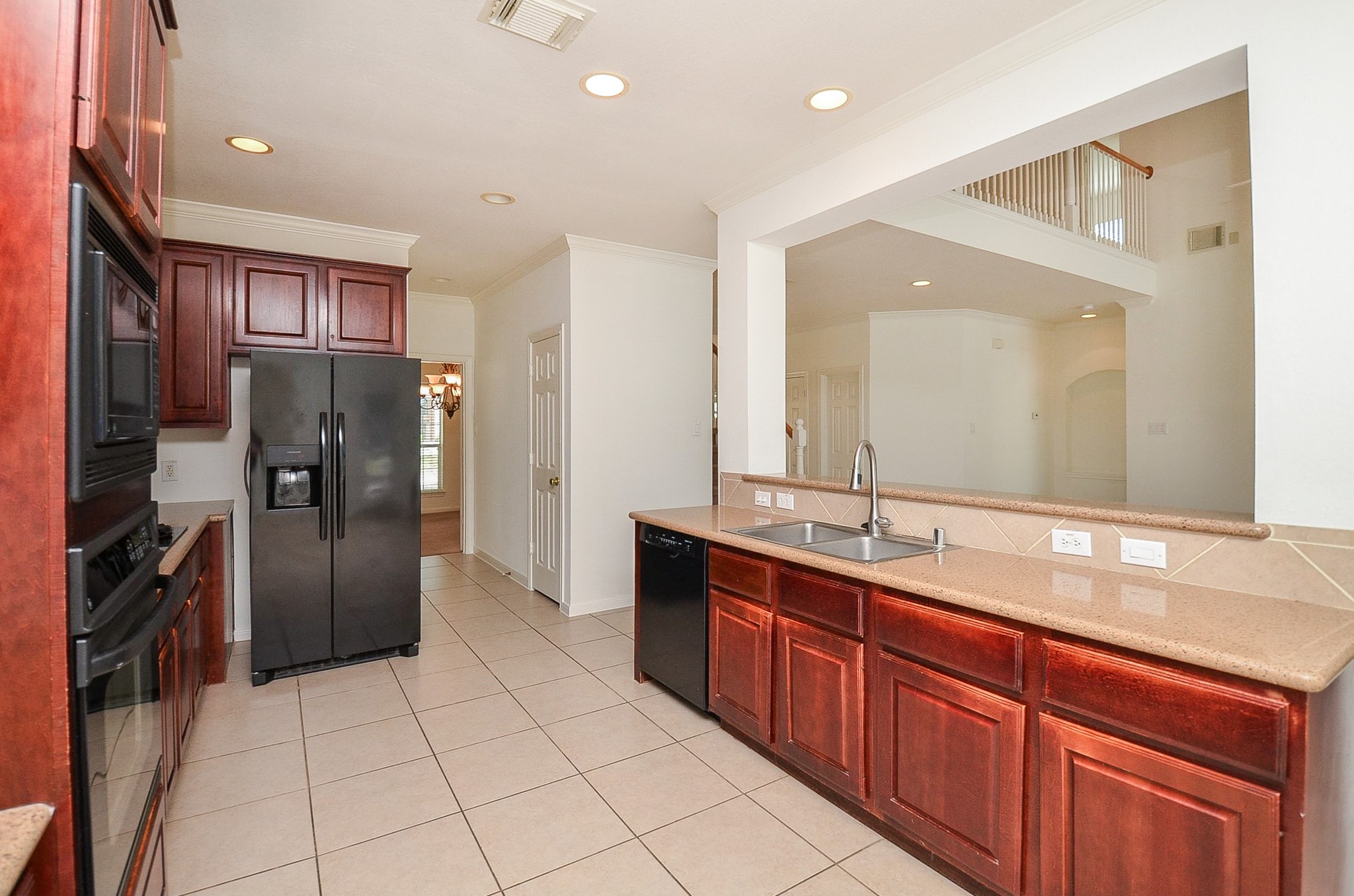 23615 Banning Point Court Katy, TX 77494 - Photo 20 of 50 a large kitchen with stainless steel appliances a sink and a refrigerator