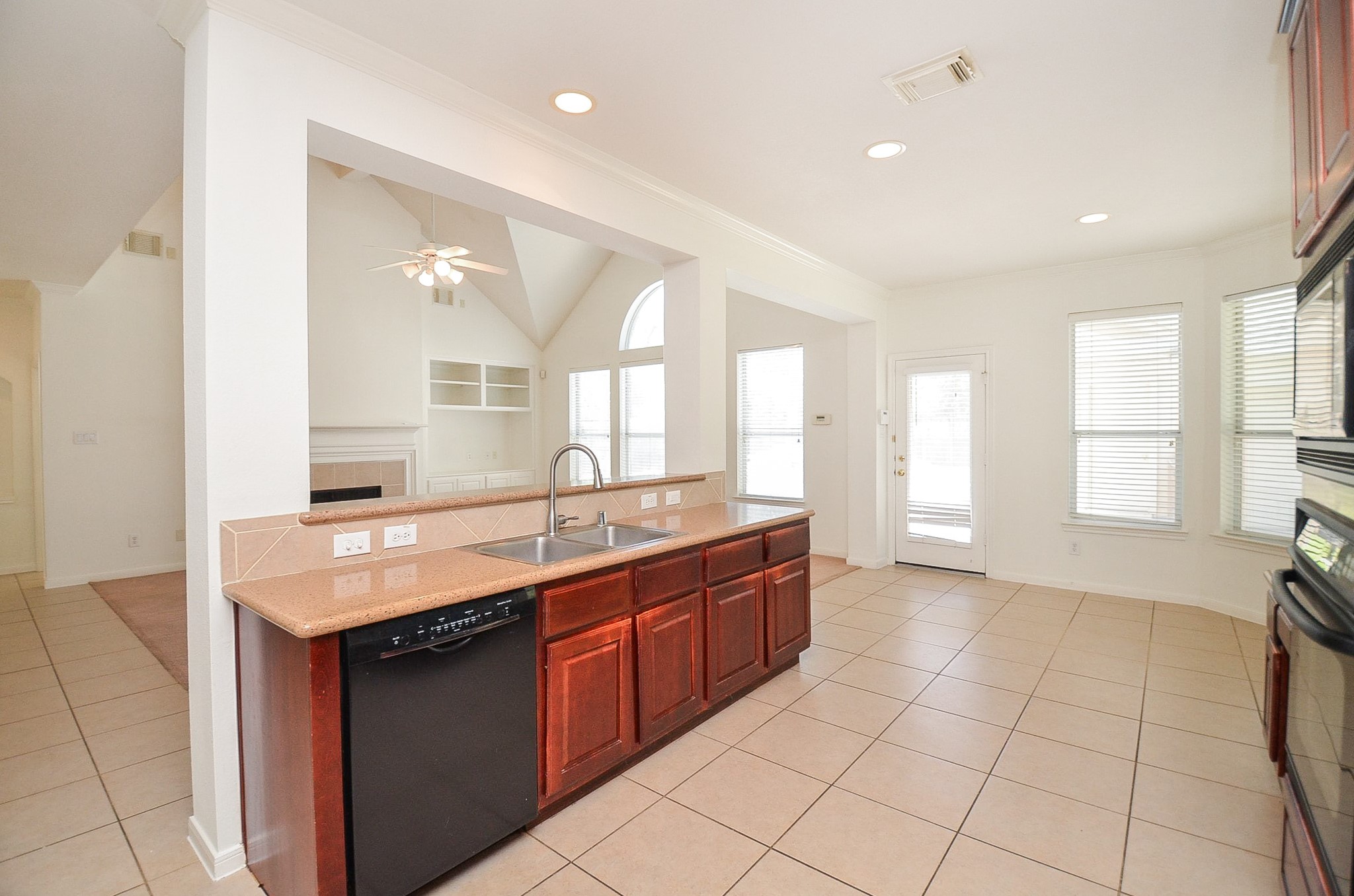 23615 Banning Point Court Katy, TX 77494 - Photo 22 of 50 a large kitchen with kitchen island granite countertop a stove a sink and a granite counter tops