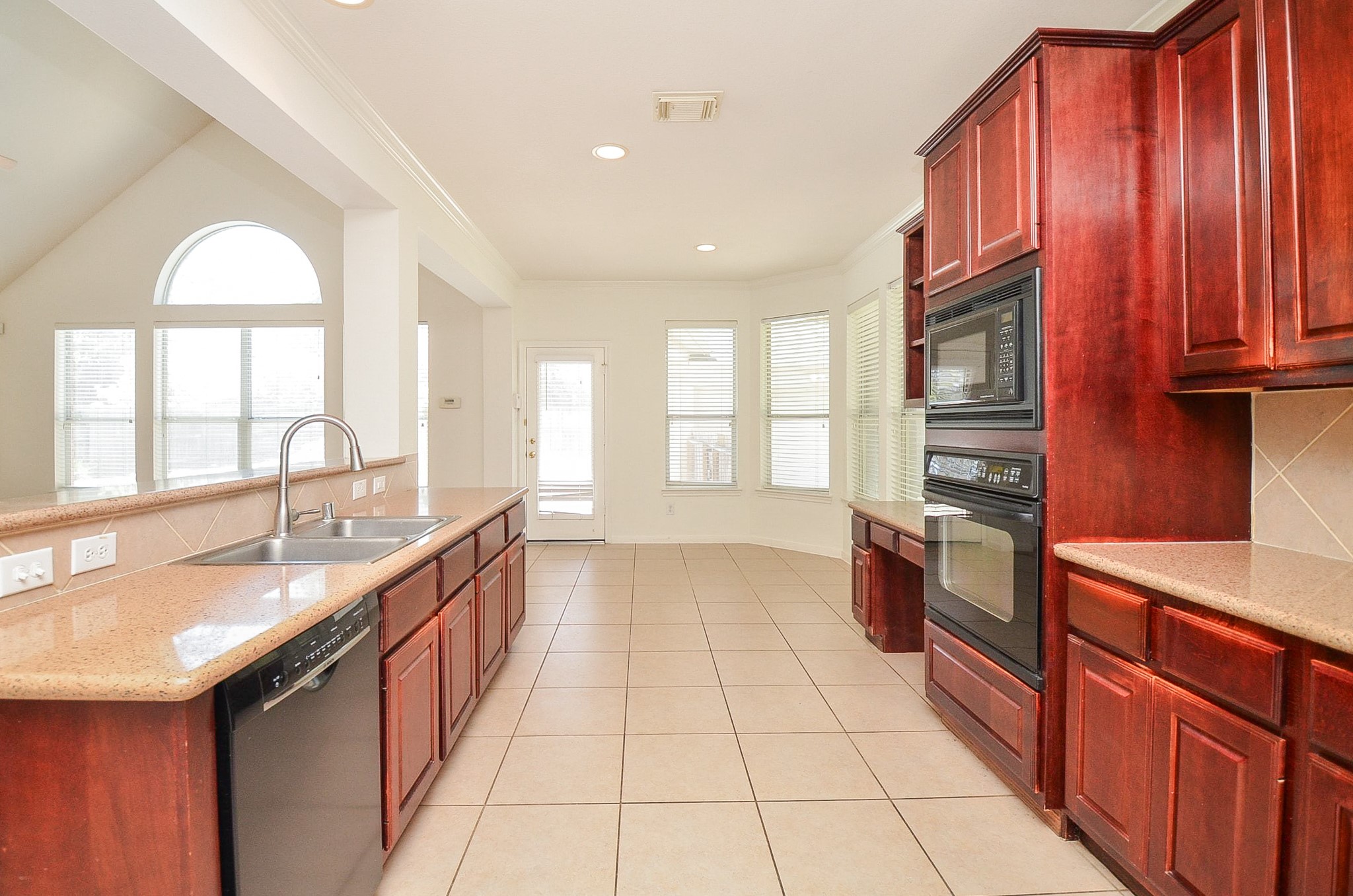 23615 Banning Point Court Katy, TX 77494 - Photo 23 of 50 a large kitchen with stainless steel appliances granite countertop a sink and cabinets
